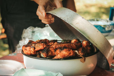 Man preparing food on barbecue grill