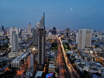 High angle view of illuminated buildings in city against sky