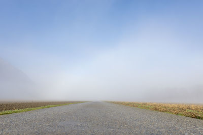 Road amidst landscape against clear sky