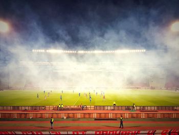 High angle view of people on field against sky