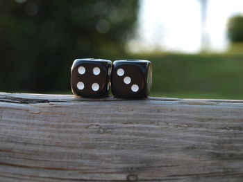 Close-up of dice on wooden table