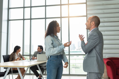 Business colleagues working in office