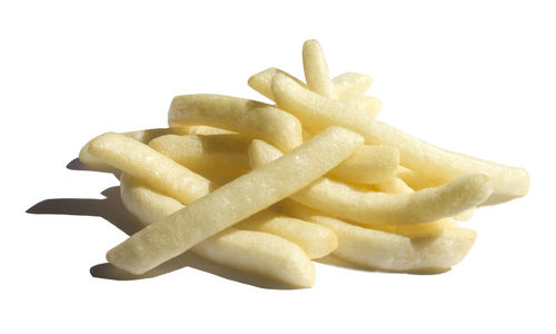 Close-up of fries on white background