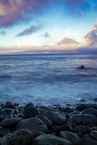 Scenic view of sea against cloudy sky