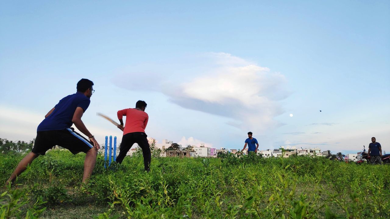 sky, group of people, real people, men, leisure activity, lifestyles, nature, land, grass, women, plant, people, full length, day, field, friendship, rear view, cloud - sky, adult, beauty in nature, outdoors