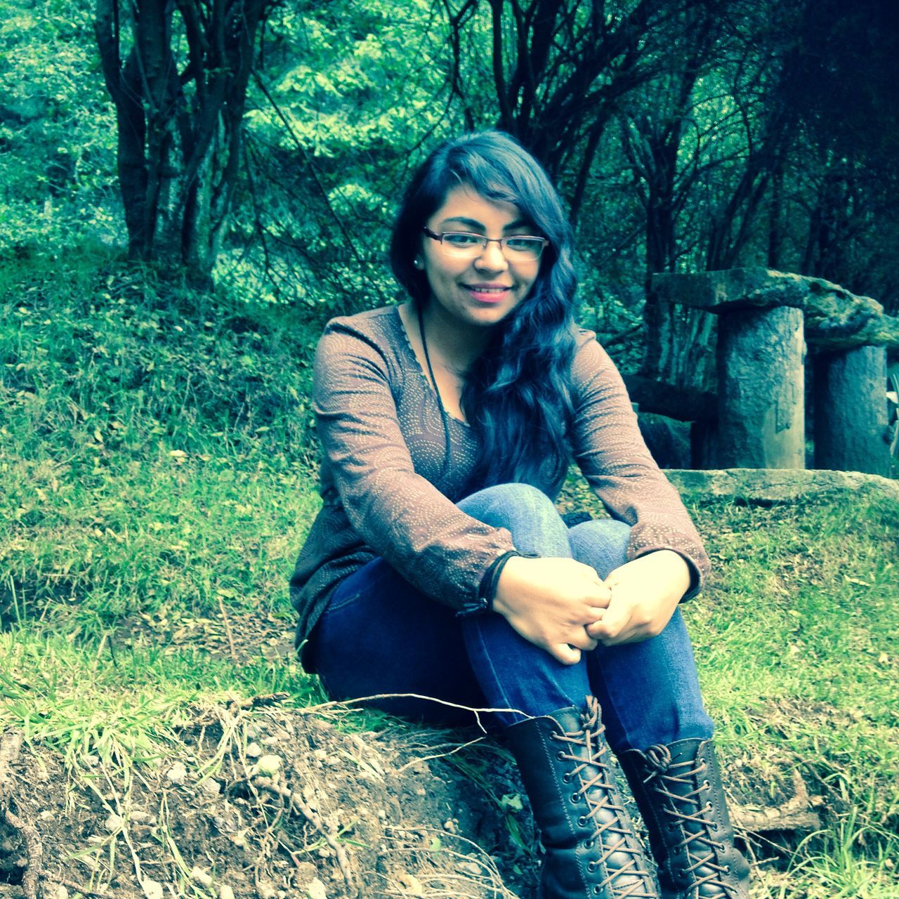 young adult, tree, young women, person, lifestyles, leisure activity, casual clothing, looking at camera, forest, portrait, front view, three quarter length, sitting, smiling, tree trunk, standing, full length