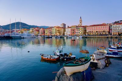 Boats moored at harbor