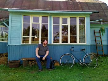 Full length of man sitting on bicycle