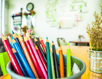 Close-up of colored pencils on table