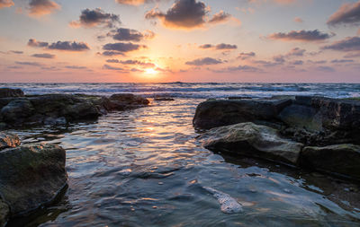 Scenic view of sea against sky during sunset