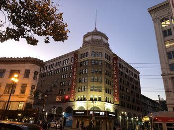 Low angle view of illuminated buildings against sky