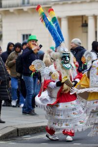 People on street in city during carnival