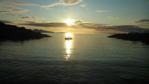 Scenic view of sea at sunset