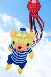 Flying kite with red octopus-shaped and bear animal