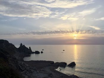 Scenic view of sea against sky during sunset