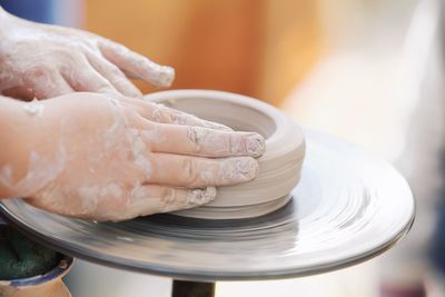 Close-up of hand holding ice cream