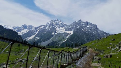 Scenic view of snowcapped mountains against sky