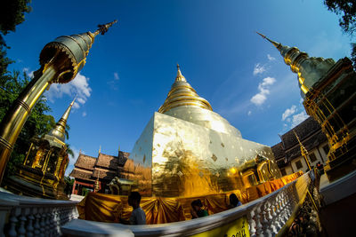 Low angle view of statue of temple against sky