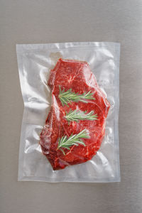 High angle view of red chili pepper against white background