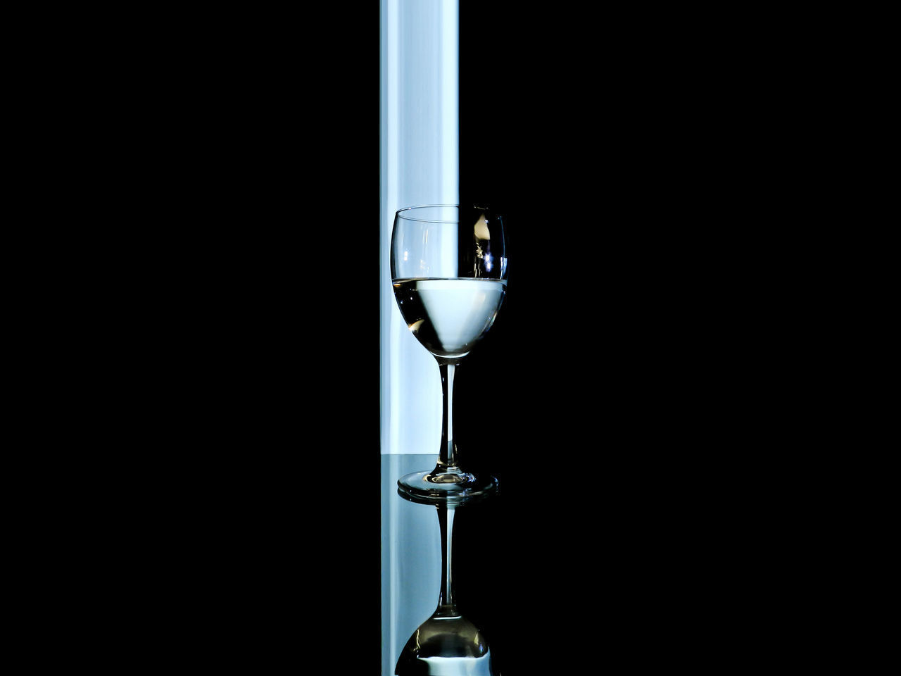CLOSE-UP OF WINEGLASS ON GLASS