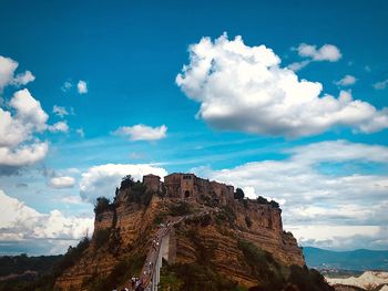 Low angle view of rock formations against sky