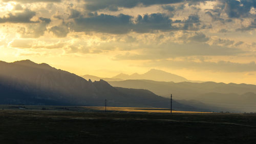 Scenic view of field against sky during sunset