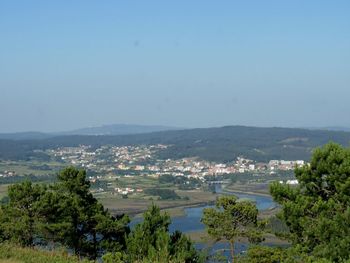 High angle view of trees and mountains against clear sky