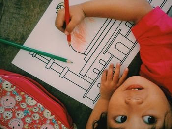 High angle view of girl drawing