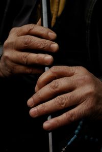 Close-up of man holding hands