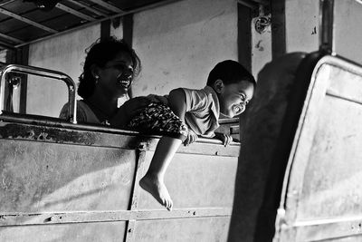 Young women smiling while sitting on floor