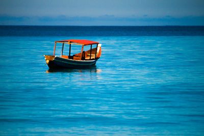 Boat in sea against sky