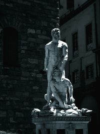 Close-up of woman against wall