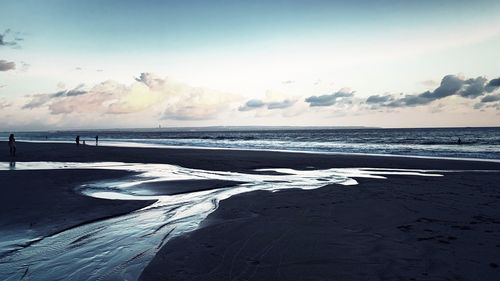 Scenic view of sea against sky during winter