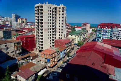 High angle view of buildings in city against sky