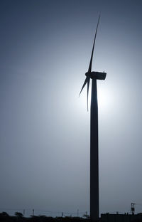 Low angle view of wind turbine against sky