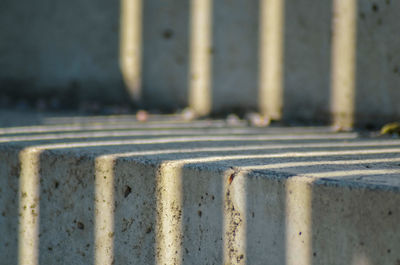 Close-up of metal railing against wall