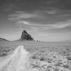 Dirt road passing through landscape