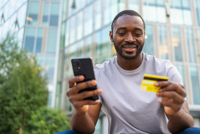 Young man using mobile phone