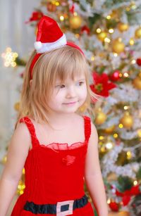 Girl looking at christmas tree