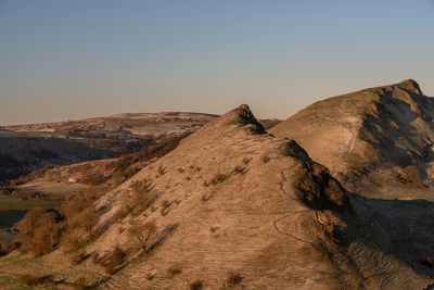 Scenic view of arid landscape against clear sky