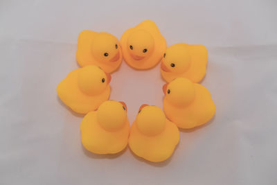 High angle view of toys on table against white background