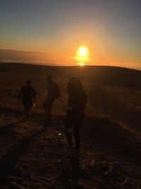 Silhouette of people on beach