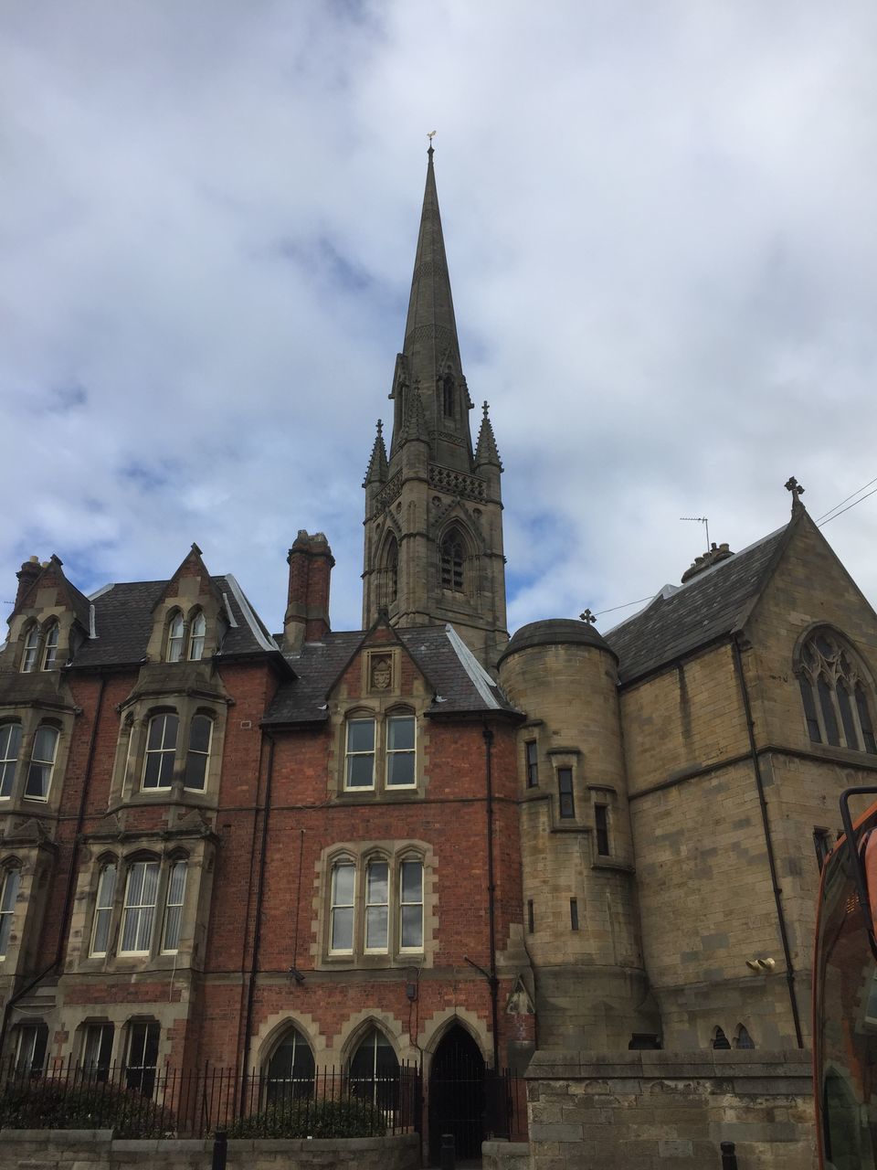 architecture, building exterior, built structure, religion, low angle view, sky, place of worship, history, spirituality, tower, cloud - sky, church, famous place, travel destinations, travel, cathedral, clock tower, tall - high