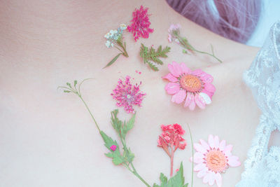 A girl's chest and flowers