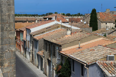 Houses in town against clear sky