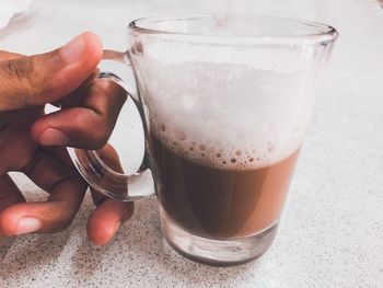 Close-up of hand holding drink