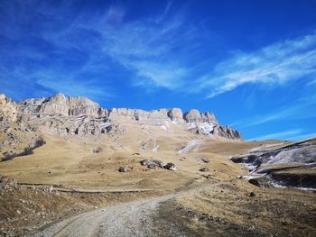 Scenic view of landscape against blue sky