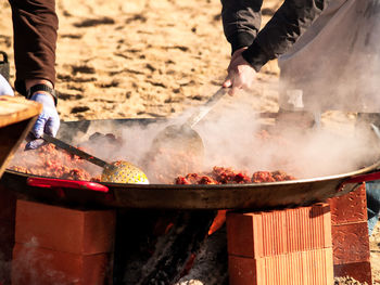 Midsection of man preparing food