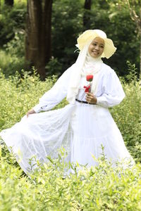 Woman standing on field