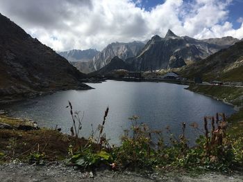 Scenic view of lake and mountains against sky